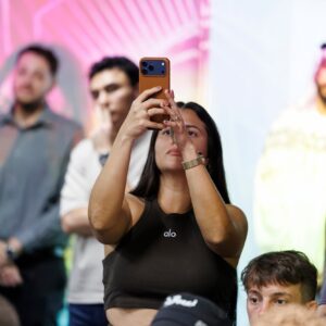 Fan photographs fighters at the UAE Warriors 74 press conference